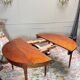 Dining table with a mahogany band in louis xvi style