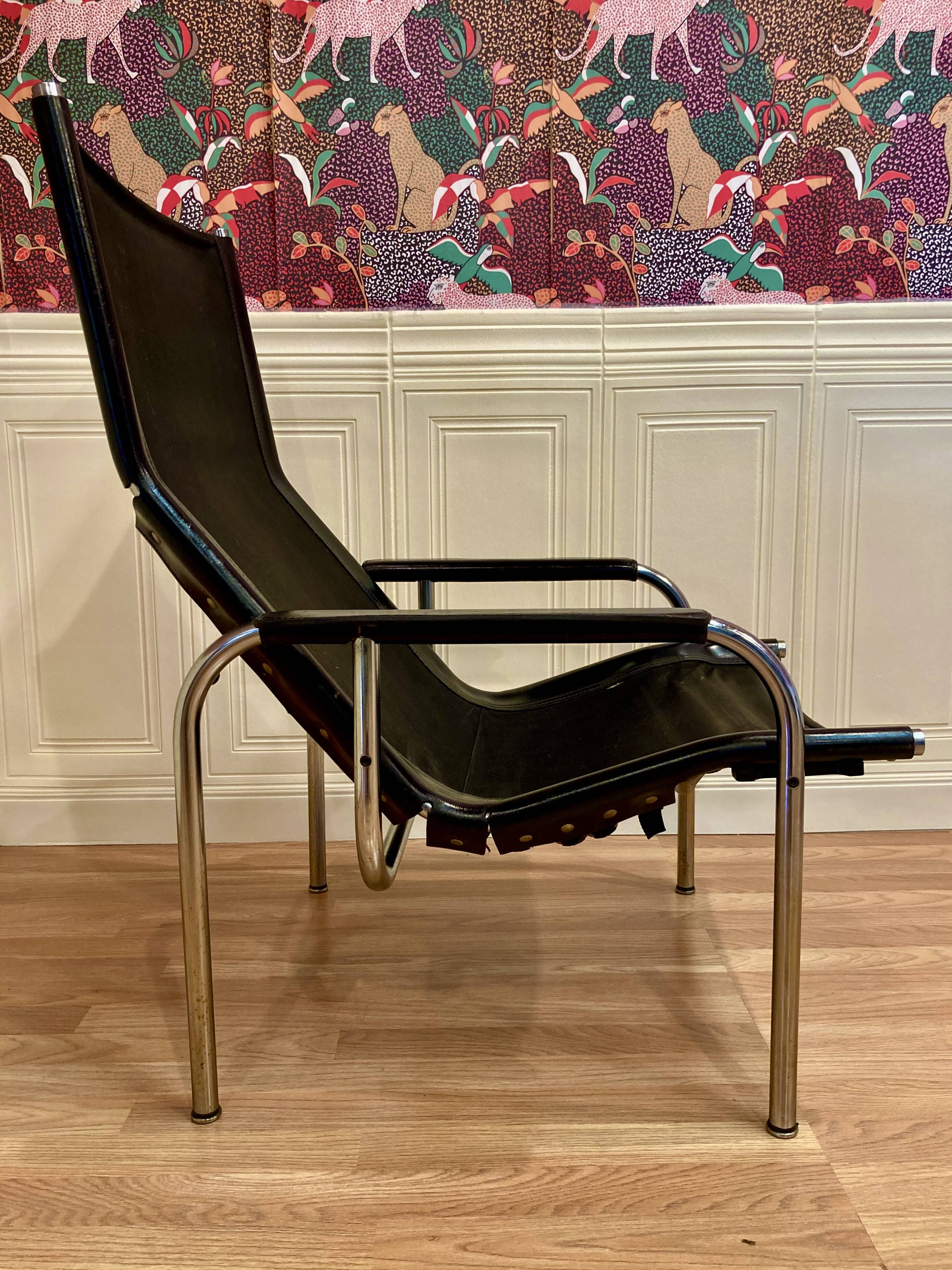 Reclining armchair in black leather and chrome design "hans eichenberger" 1960.