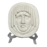 Visage en bas relief style masque antique