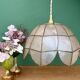 Vintage pendant light in mother-of-pearl and brass.