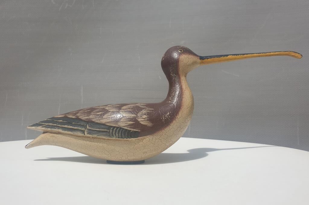 Carved painted wooden curlew