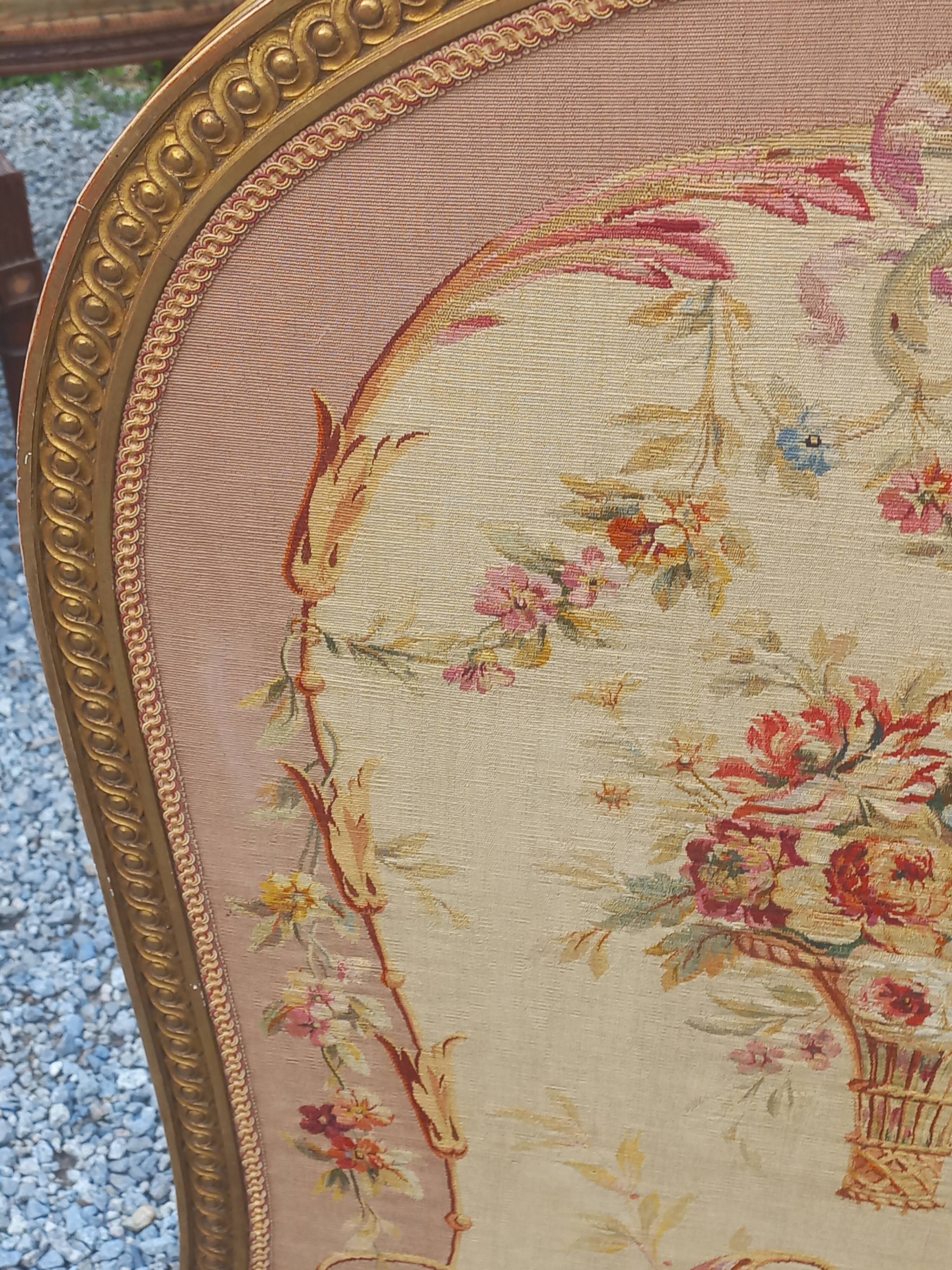 Golden wooden fireplace screen and Aubusson tapestry, 19th century.