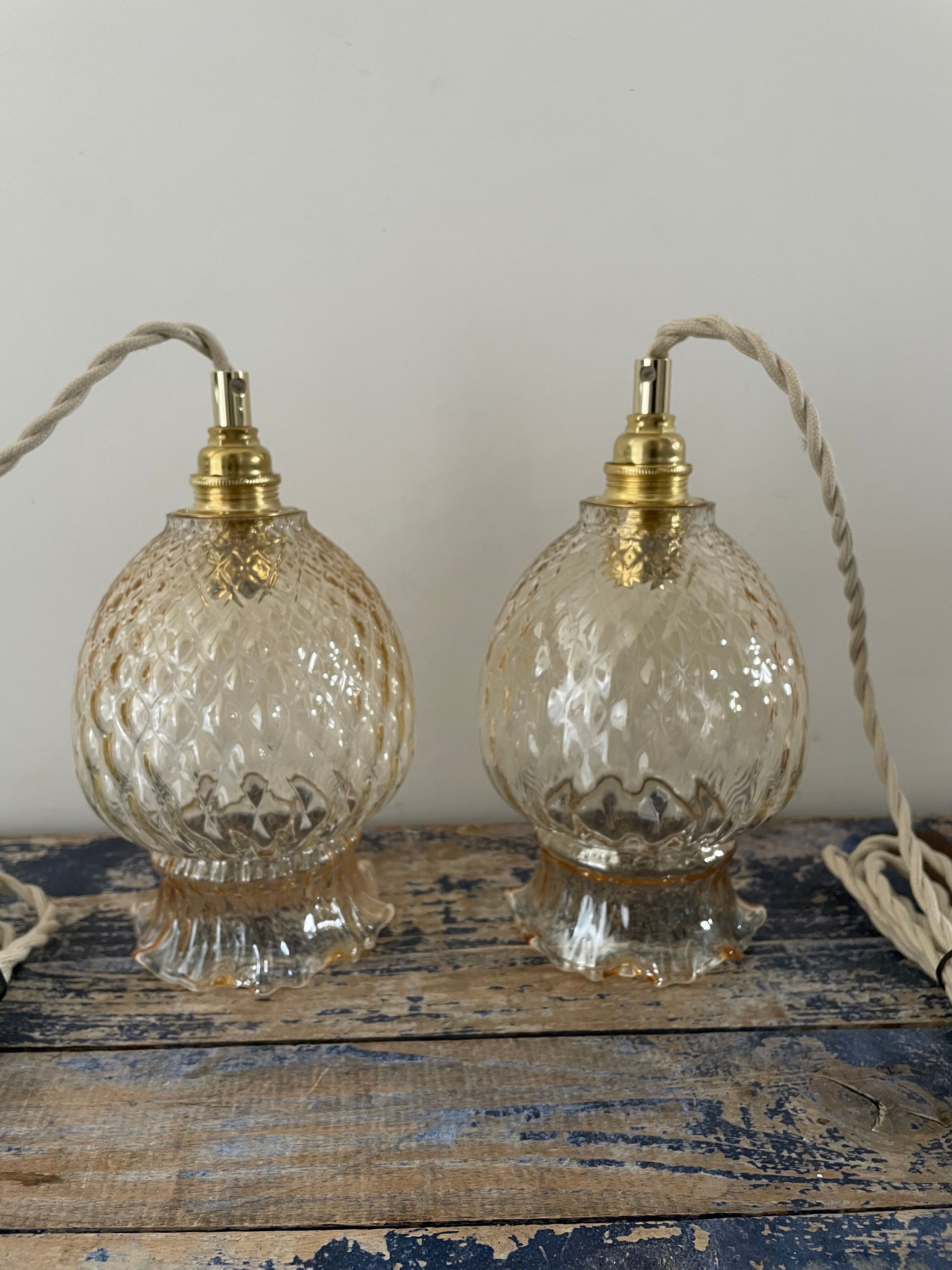 Set of two vintage golden glass handhelds