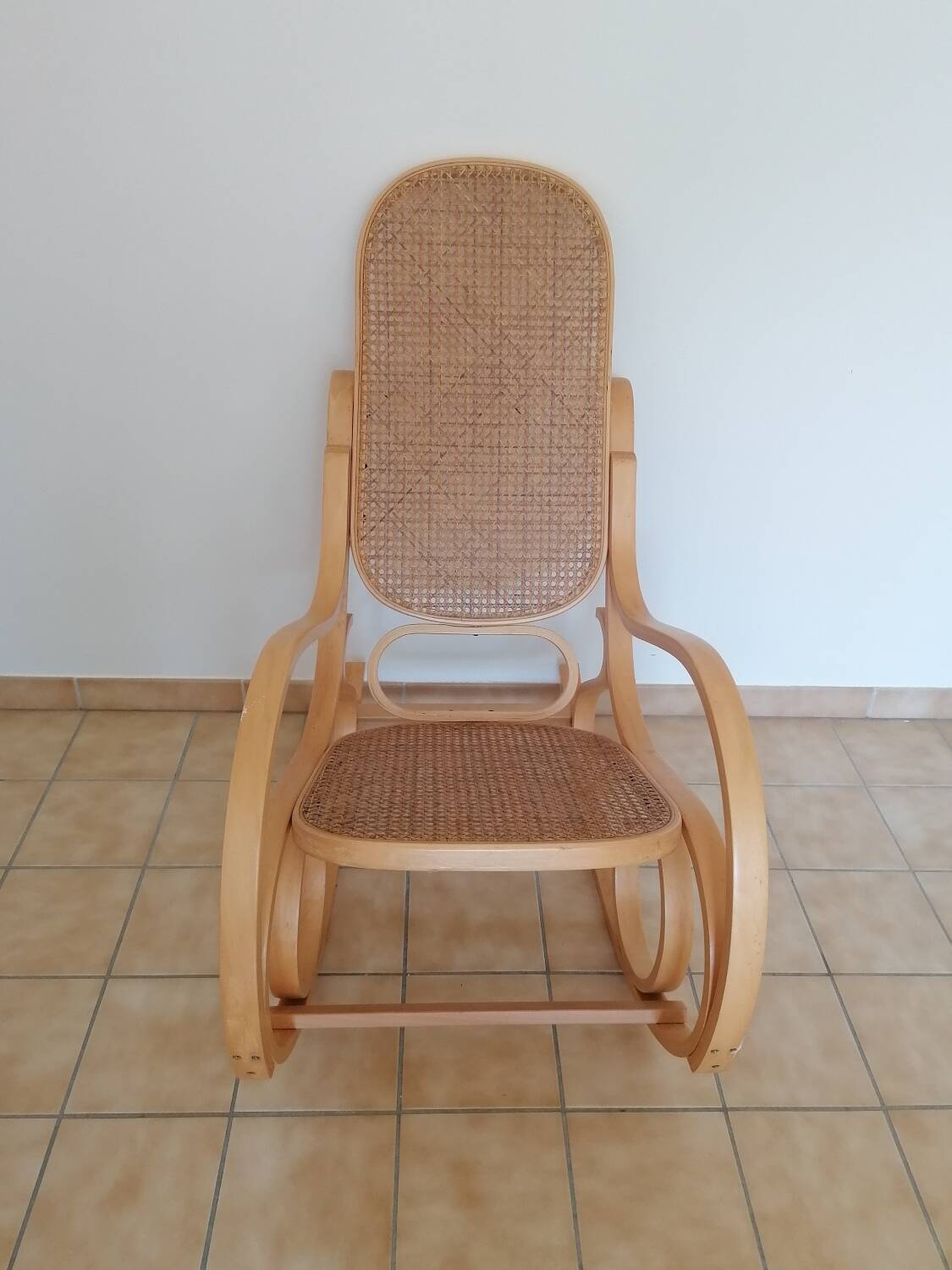 Wooden and cane rocking chair