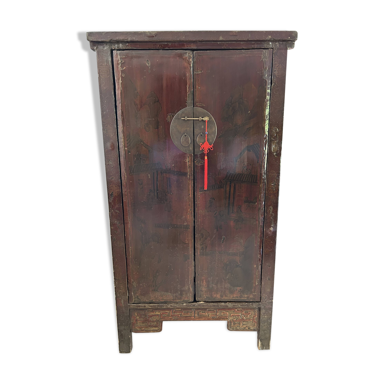 Antique Chinese wardrobe in carved elm.