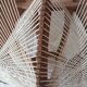Scandinavian hanging lamp in wood and stretched wires
