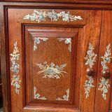 Corner showcase inlaid with mother-of-pearl, silver and copper.