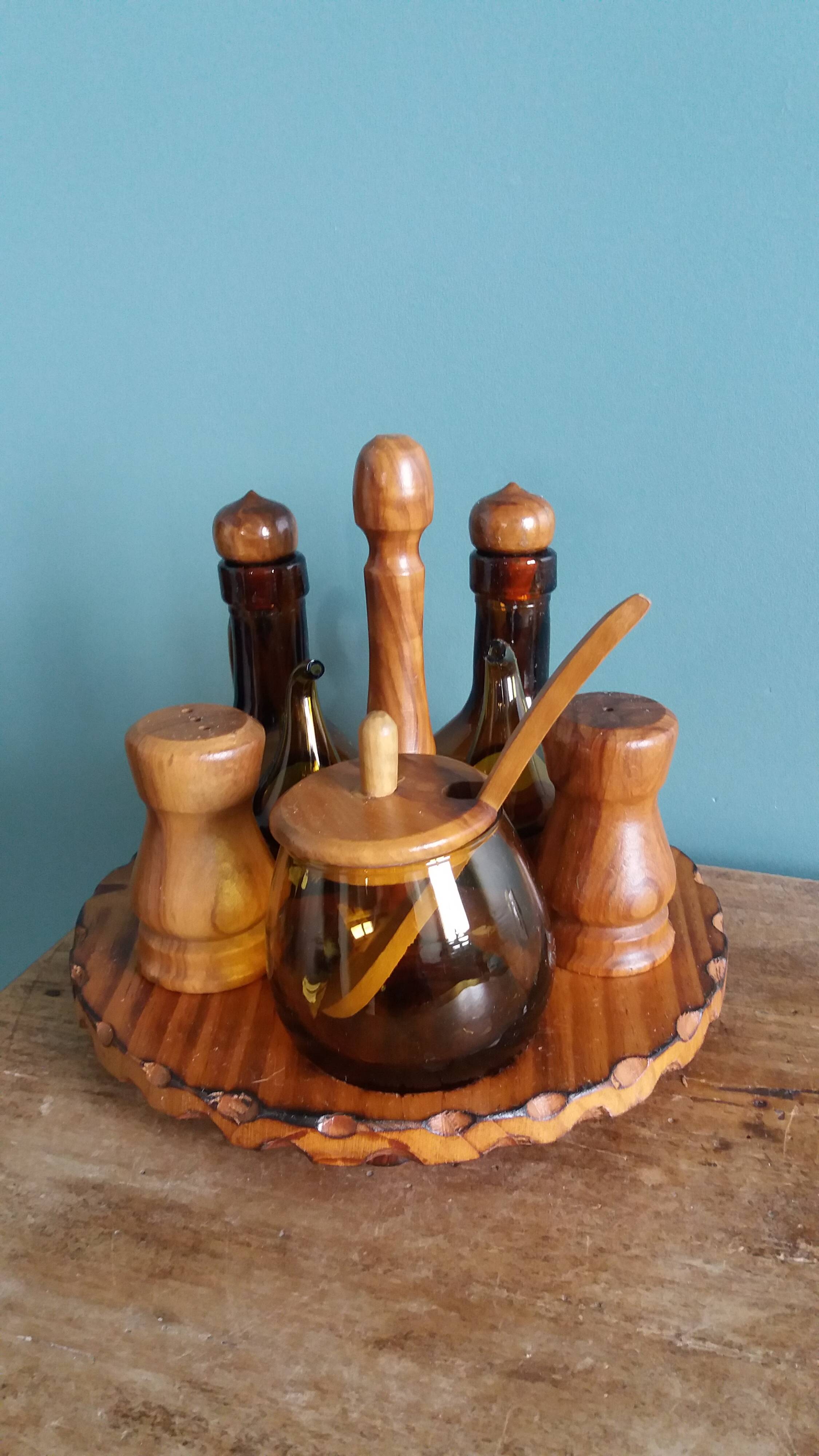 Oil, vinegar, mustard, pepper, salt, olive wood servant from Spain.