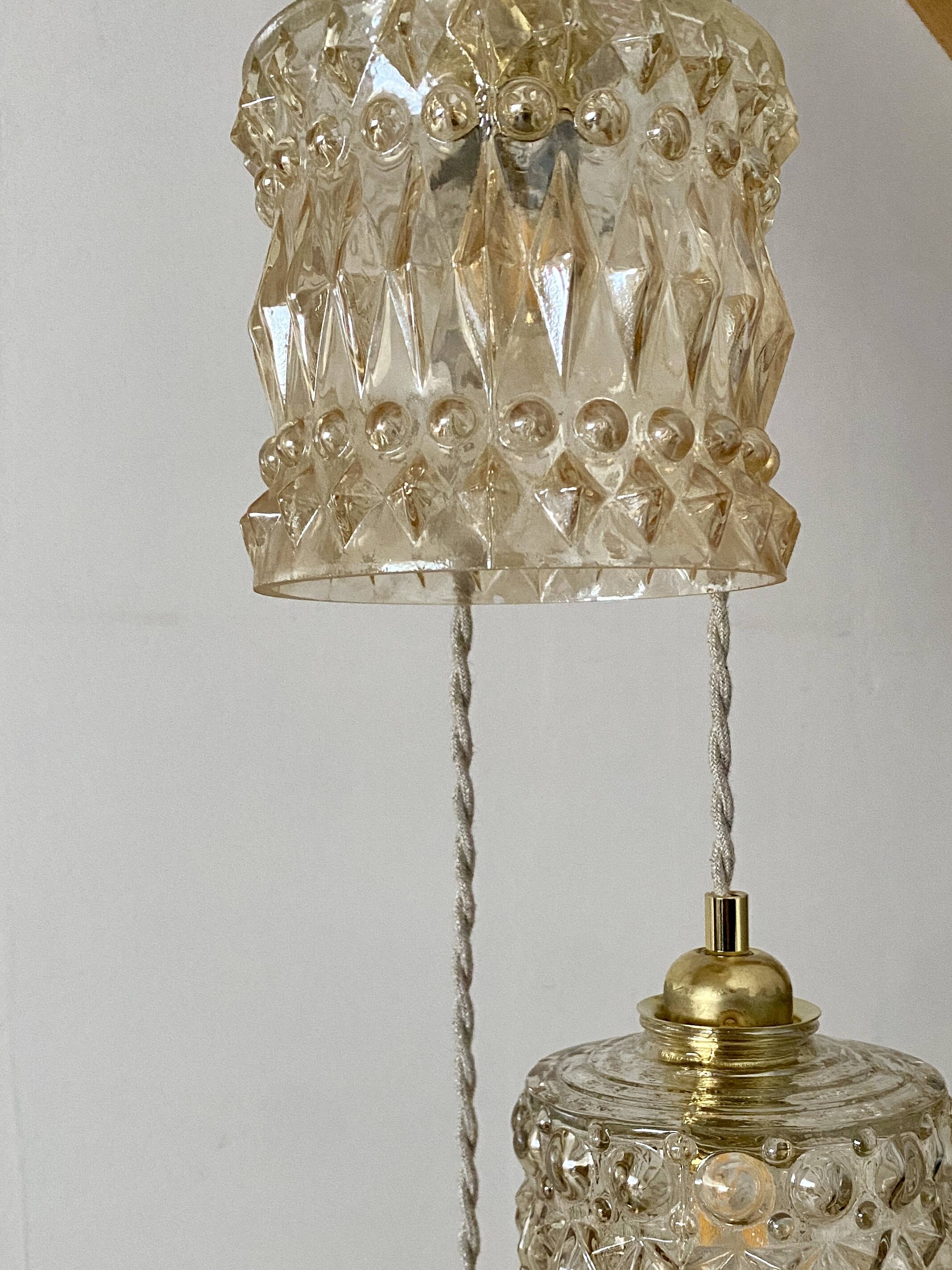 Triple antique globe pendant light in amber glass