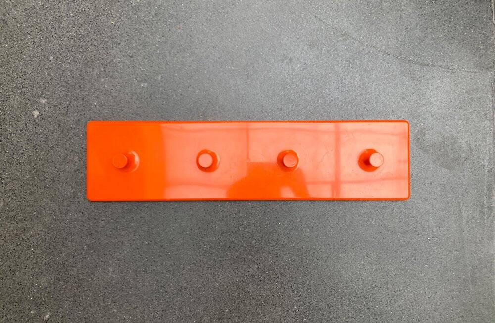 Orange coat rack from the mid-century space age, 1960s.