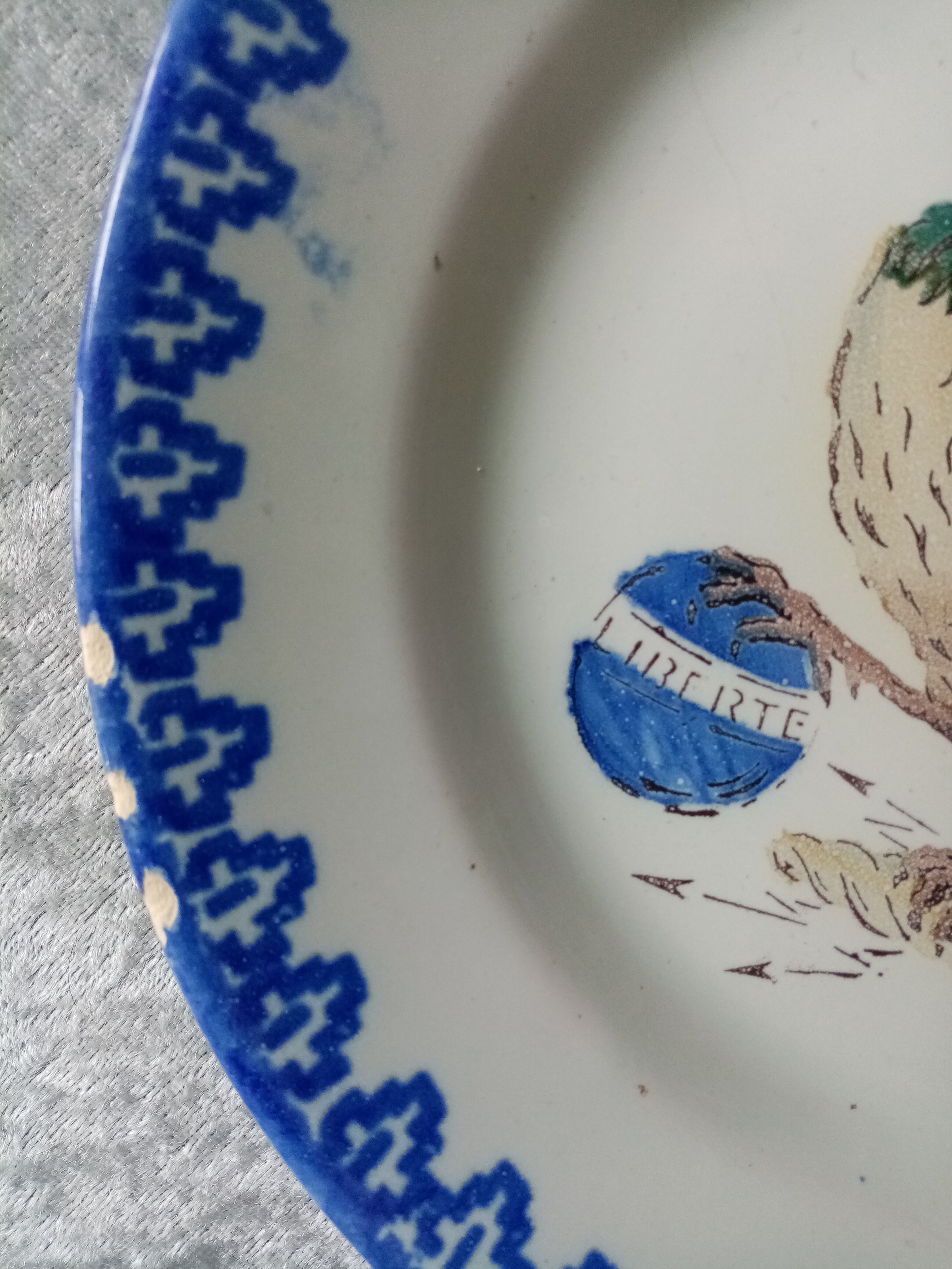 18th century decorative plate in Saint Clement earthenware signed with rooster decoration