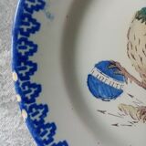 18th century decorative plate in Saint Clement earthenware signed with rooster decoration