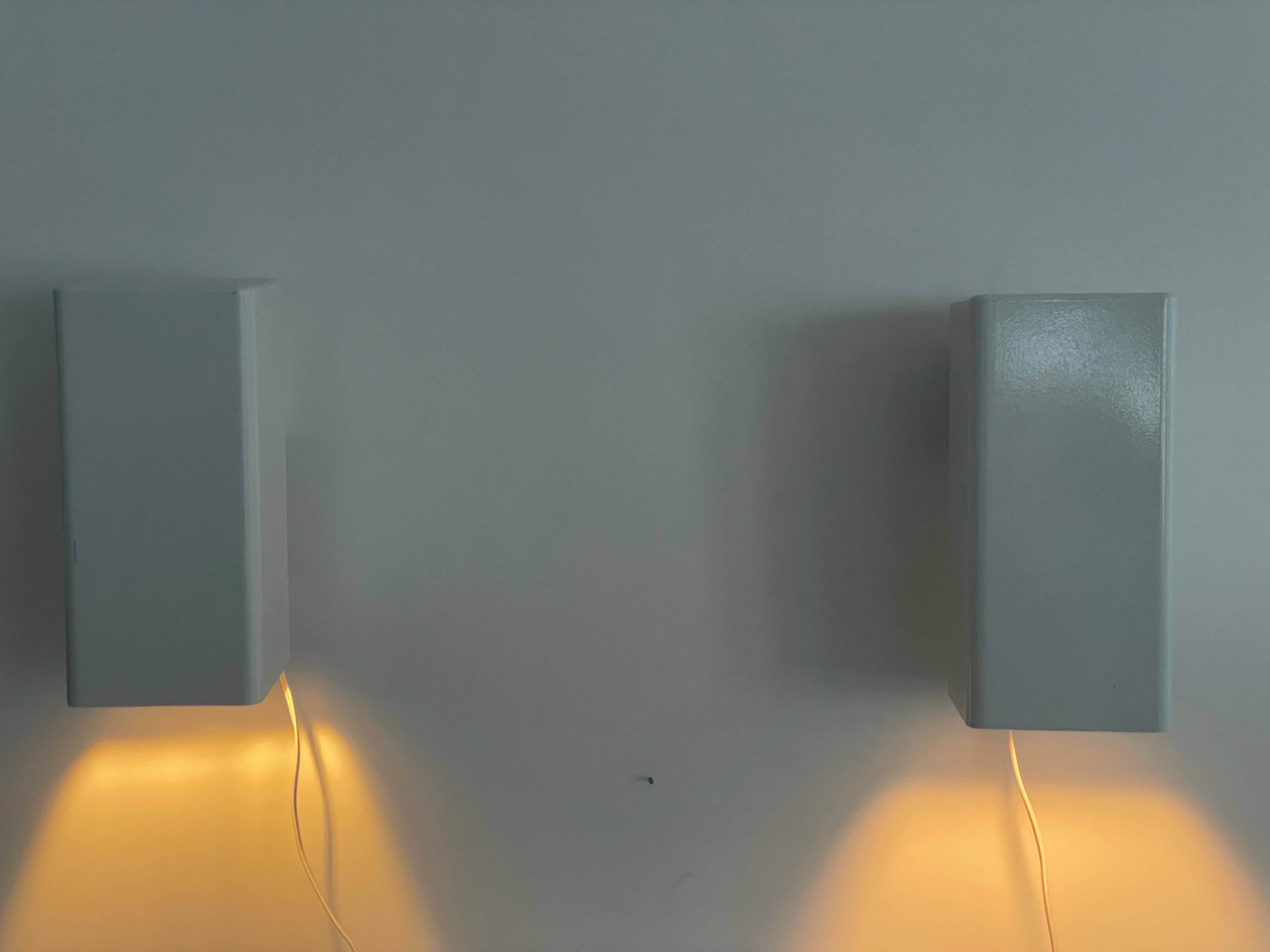 Pair of minimalist white metal wall lights from the mid-century, 1960, Germany.