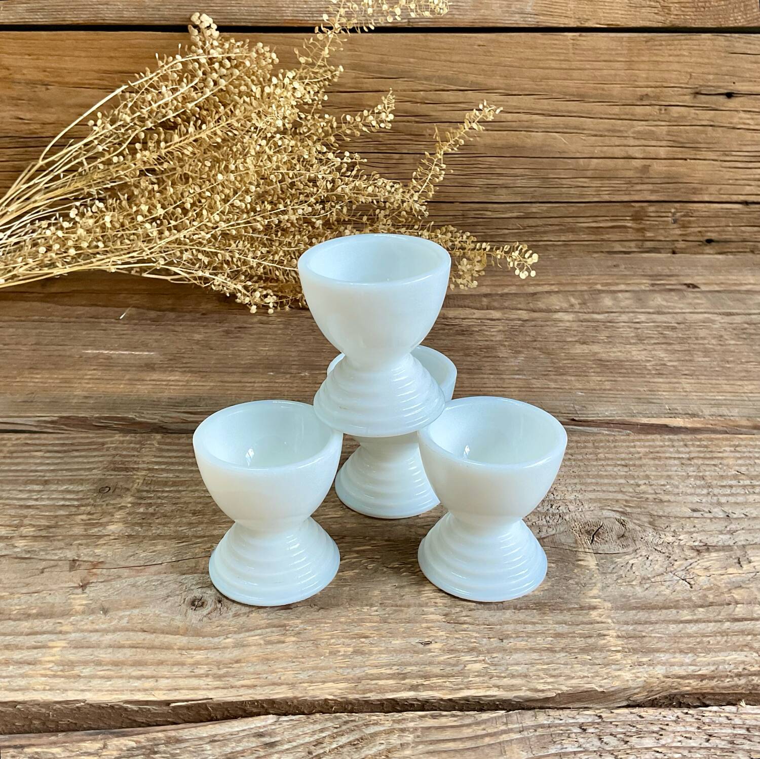 4 egg cups in white opaline glass