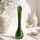 Single flower vase in blown green glass