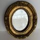 Small old mirror in gilded wood
