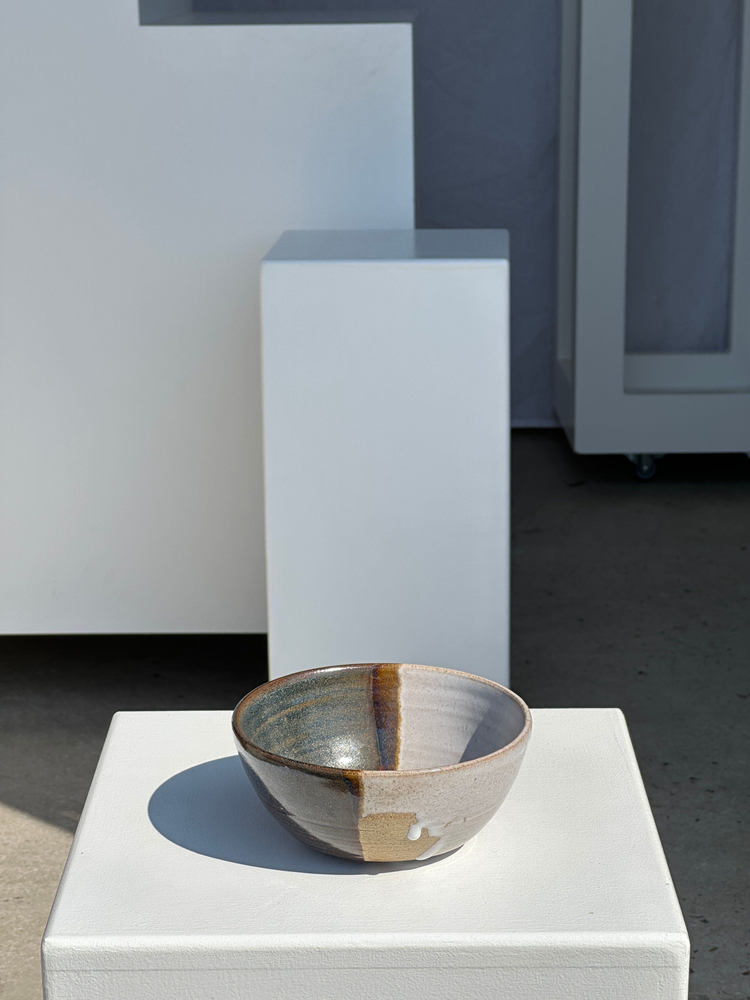 White and glossy brown two-tone ceramic bowl, matt earth