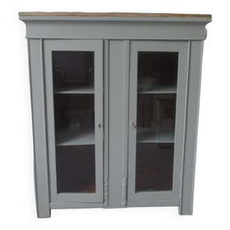 Vintage display cabinet sublimated in verdigris waxed finish, 2 doors with beveled and cut windows.