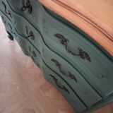 Dark green patina crossbow chest of drawers