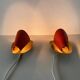 Pair of orange plexiglass and curved brass wall lights, 1950s, Germany