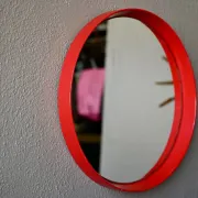 Round Pop Art mirror from the 60s-70s in bright red plastic.
