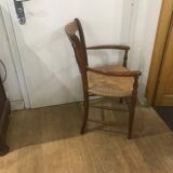 Curved armchair in wood and straw