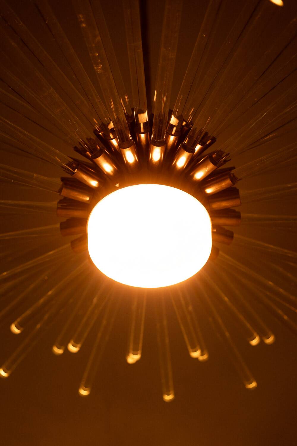 Radiant glass tube chandelier. Contemporary design.