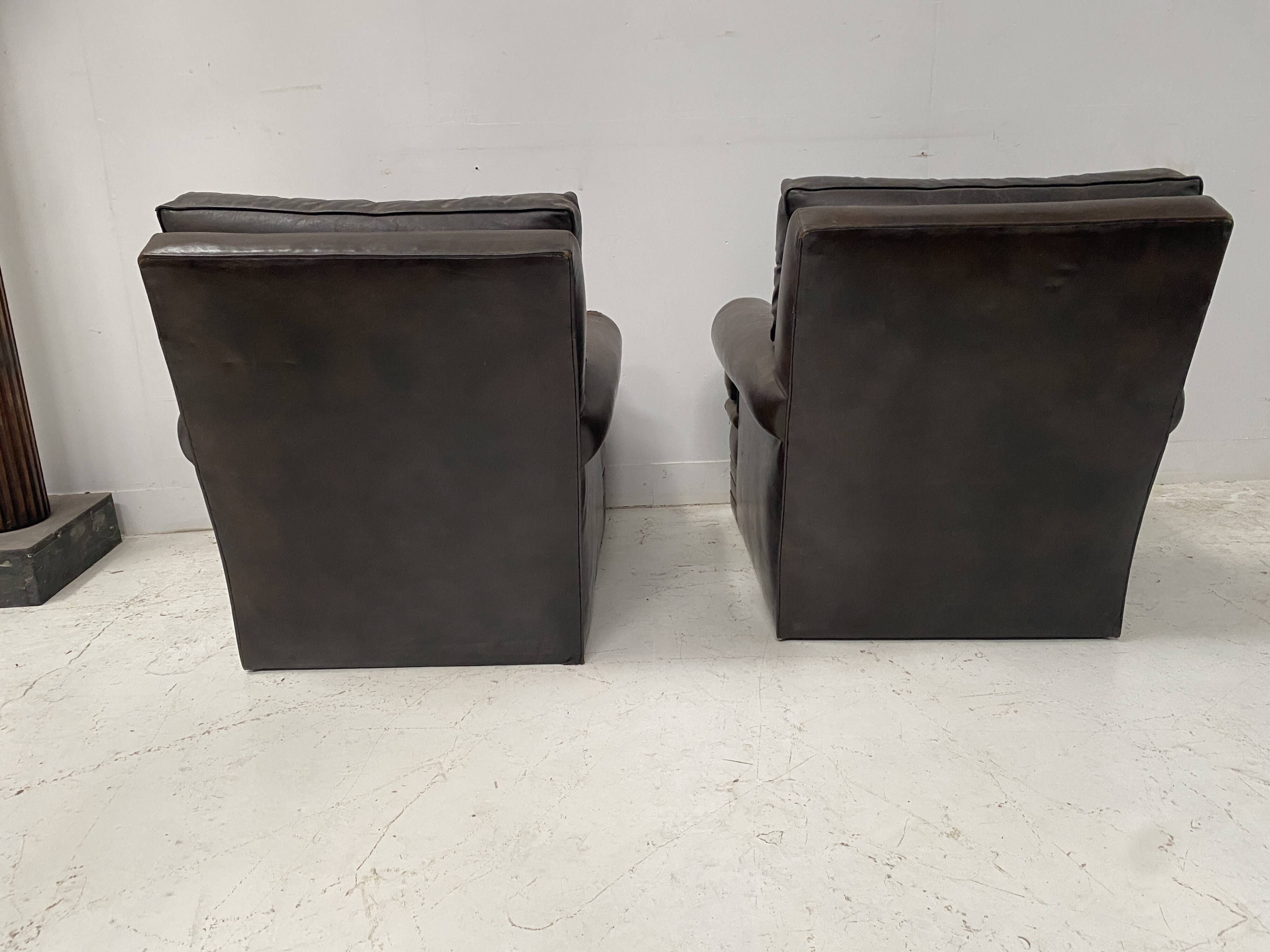 Pair of vintage brown leather armchairs from the 1970s.