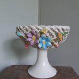 Cup on woven ceramic base with slip flowers