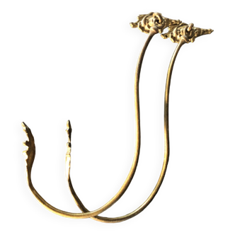 Pair of bronze tiebacks