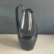 Black glazed ceramic pitcher signed M Azouit
