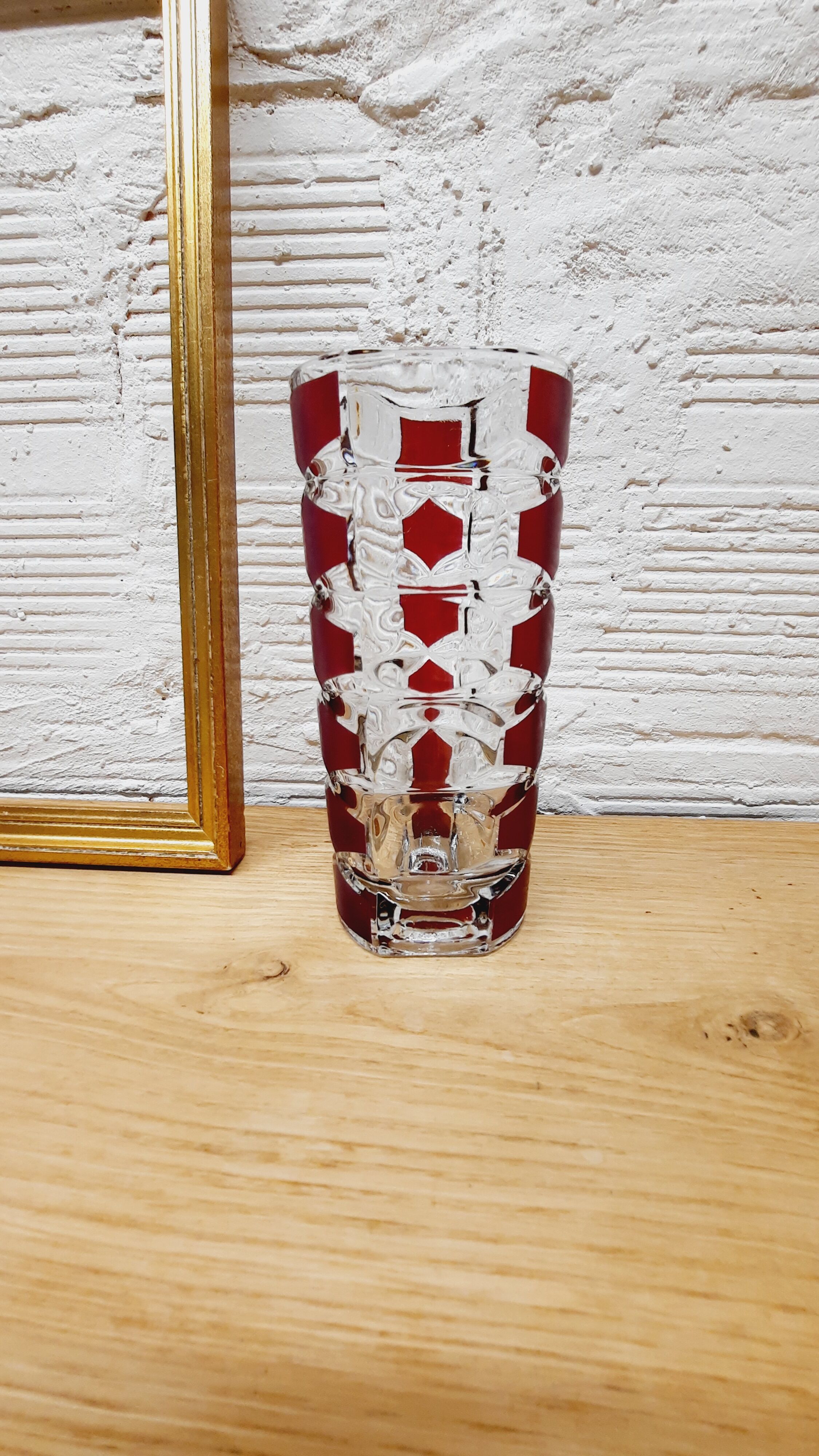 Glass vase with colored facets