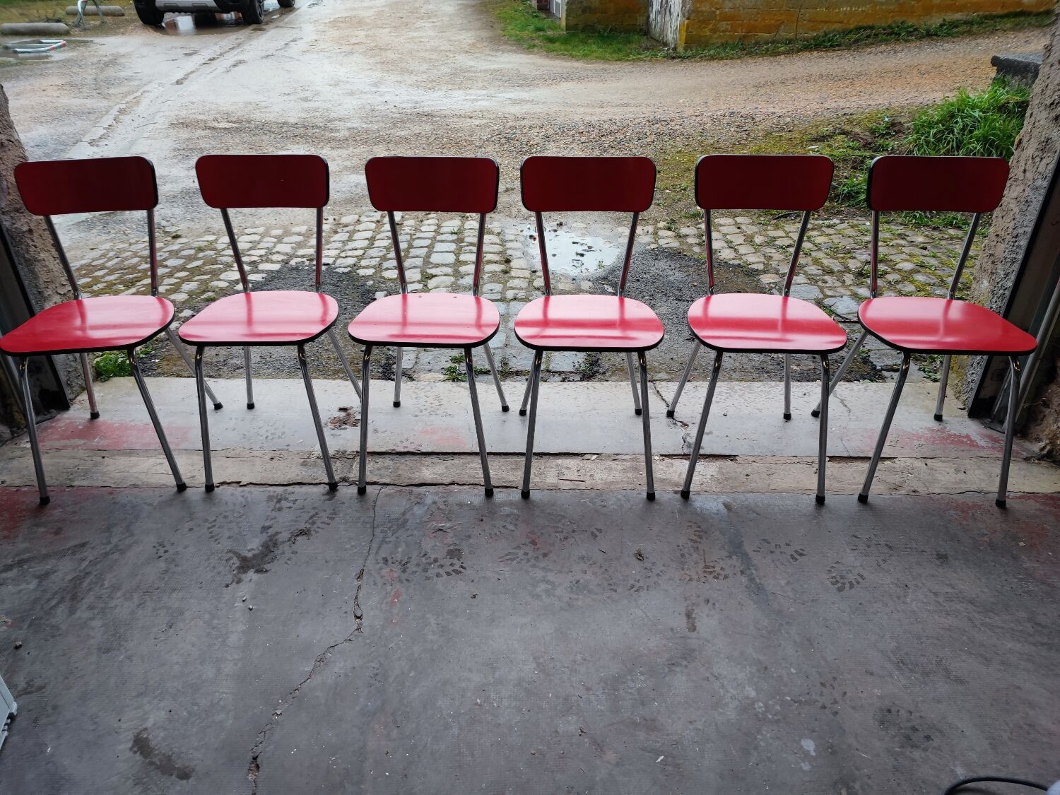 6 red and chrome Formica chairs