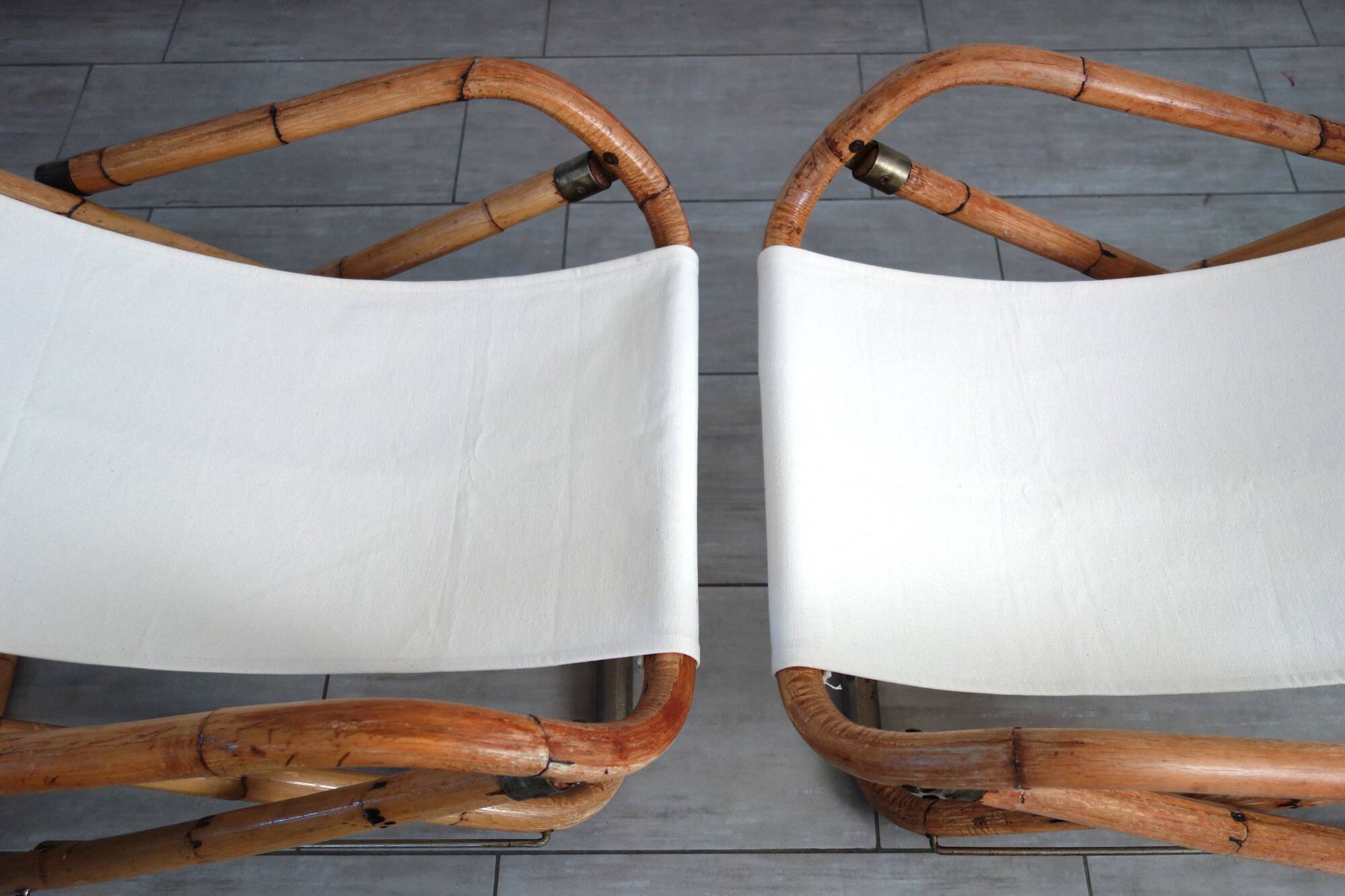 Pair of folding bamboo and brass deck chairs, Italy, 1960s.