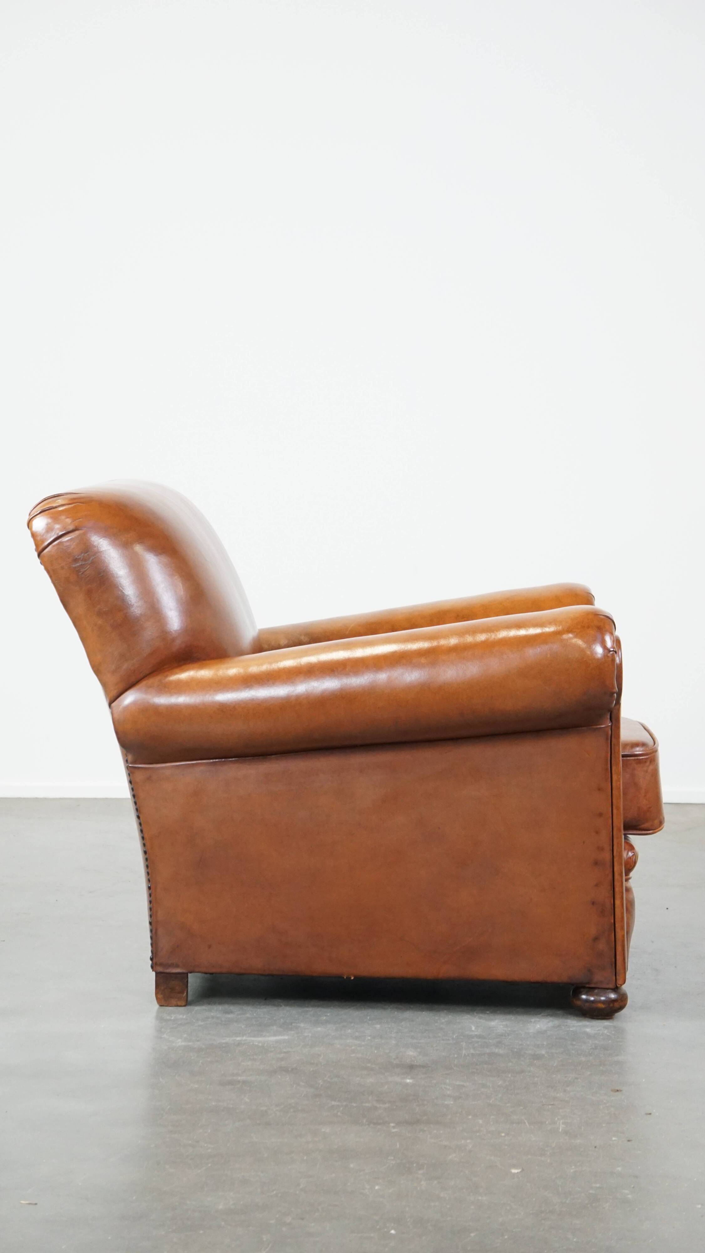 Cognac-colored antique sheep leather armchair