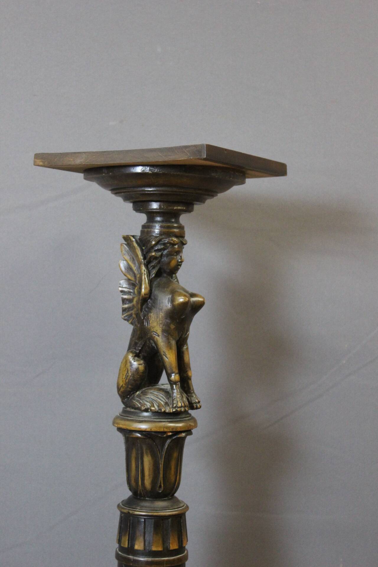 Presentation column with a carved Sphinx decoration from around 1900.
