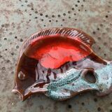 Empty pocket in glazed ceramic slip in the shape of vintage fish