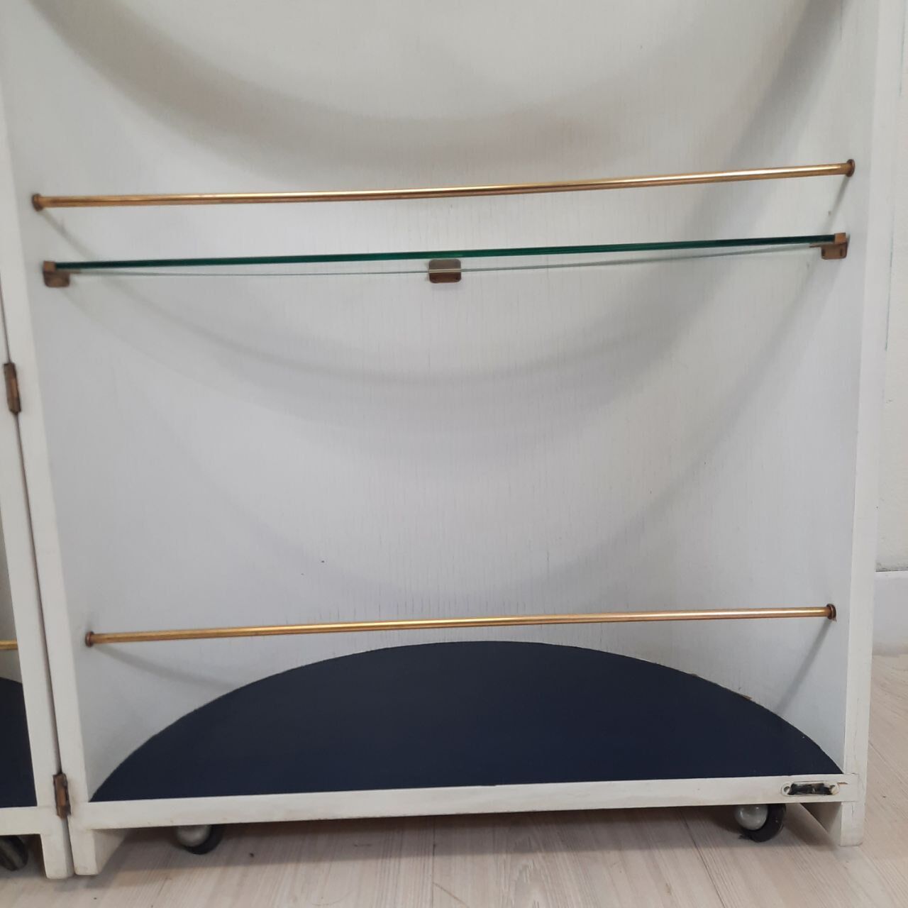 Vintage openable cylinder shaped bar cabinet, wood, brass and glass.