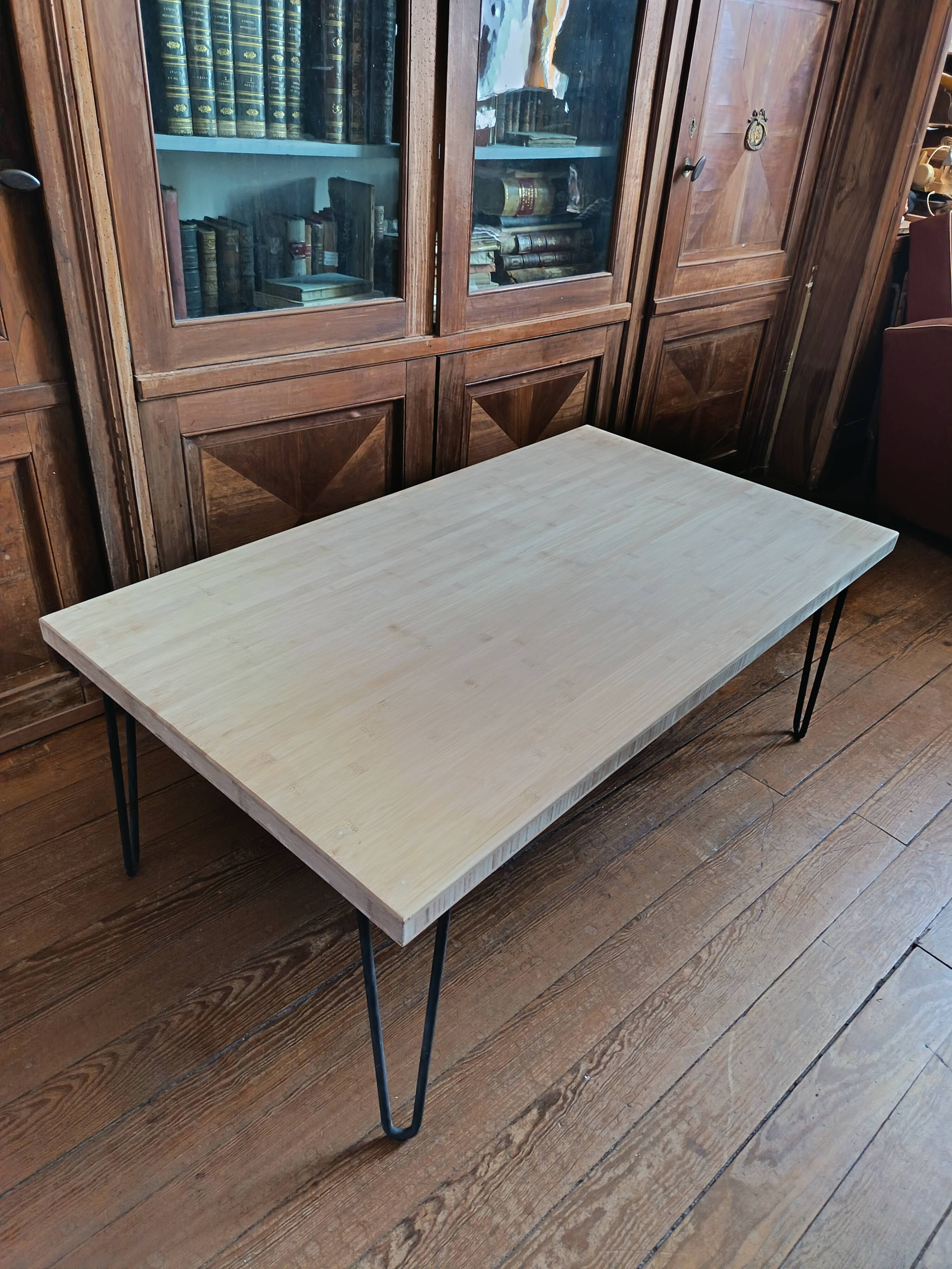 Coffee table in solid bamboo with steel legs.