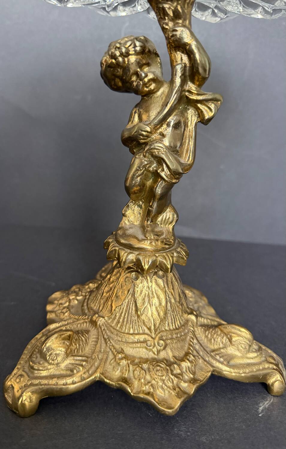 Antique crystal bowl on a bronze stand.