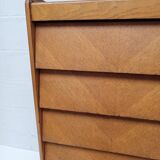 High wooden chest of drawers in the 50s
