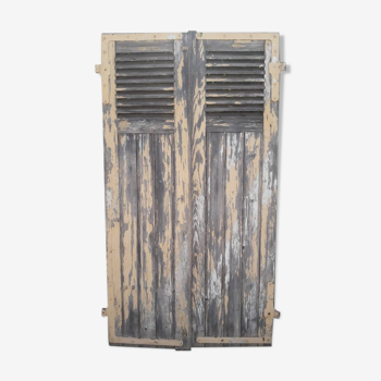 Pair of old shutters part with louvers