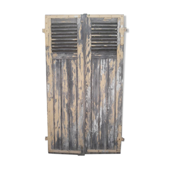 Pair of old shutters part with louvers