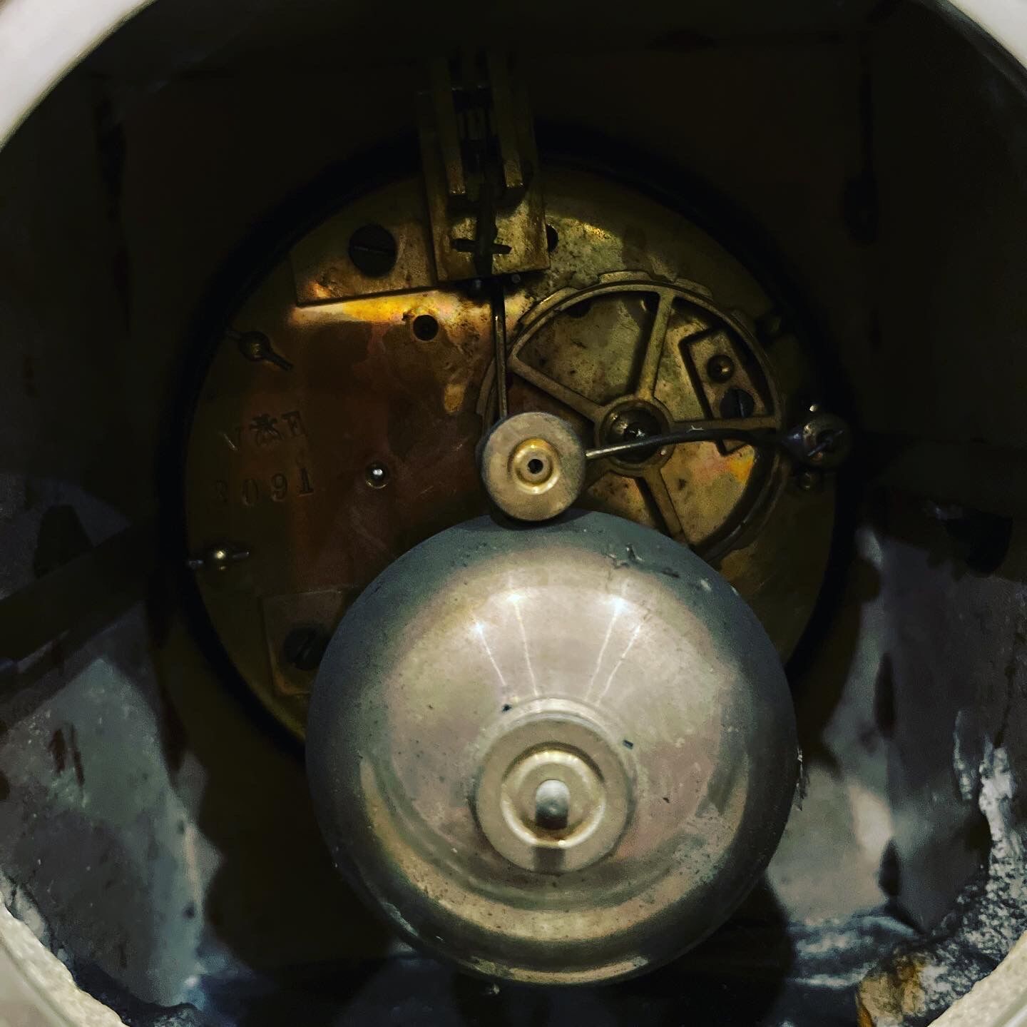 Black marble clock and brass ornament