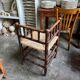 Corner chair in turned wood and straw