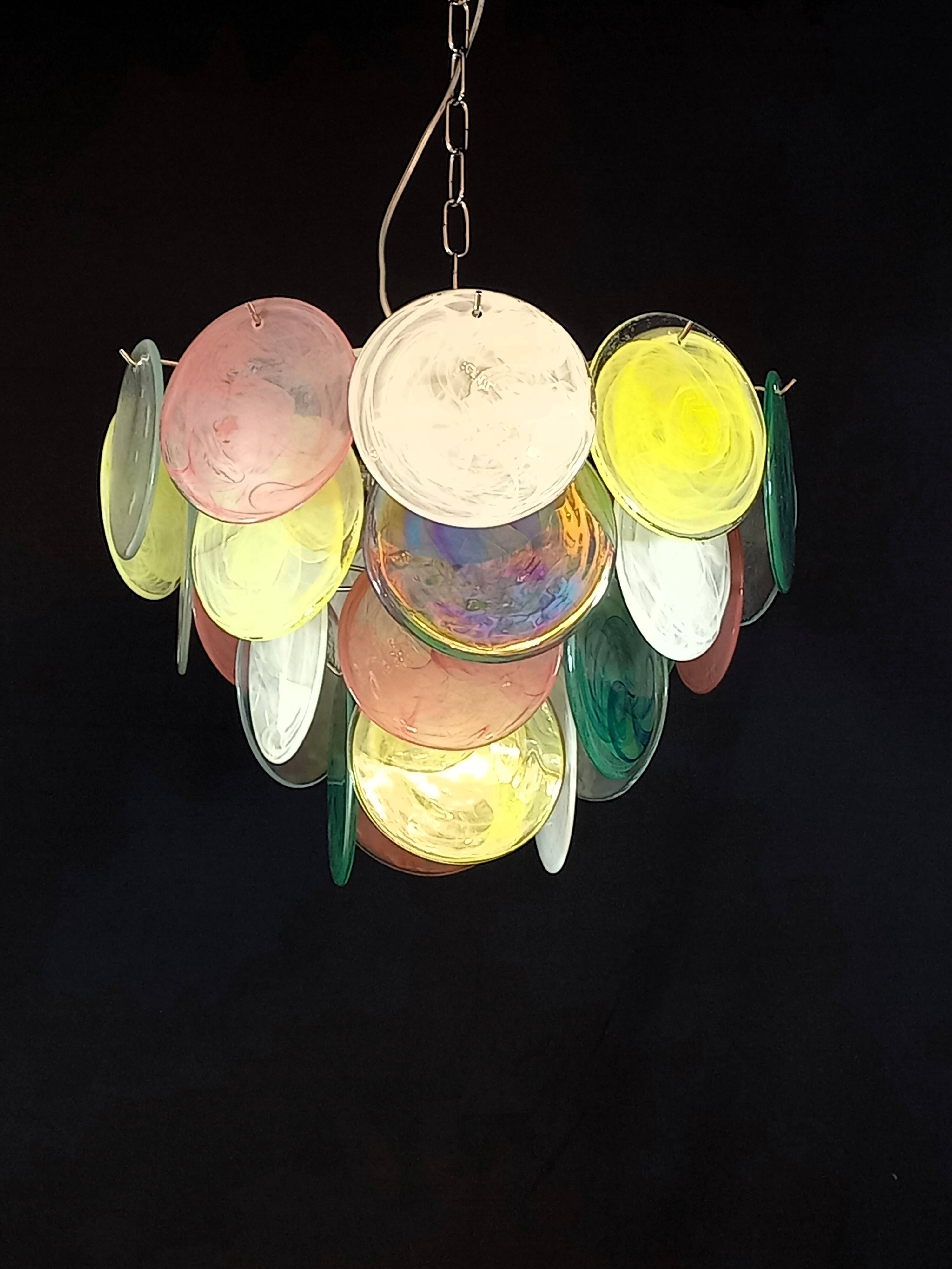 Handcrafted chandelier with Murano glass discs.