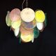 Handcrafted chandelier with Murano glass discs.