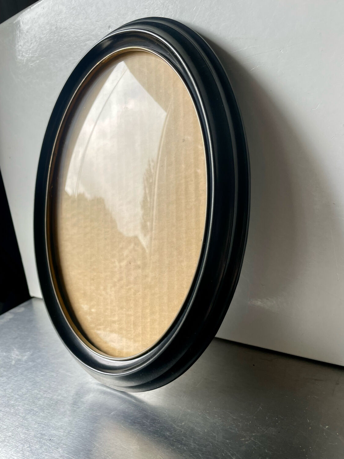 Oval bakelite black vintage frame with convex glass