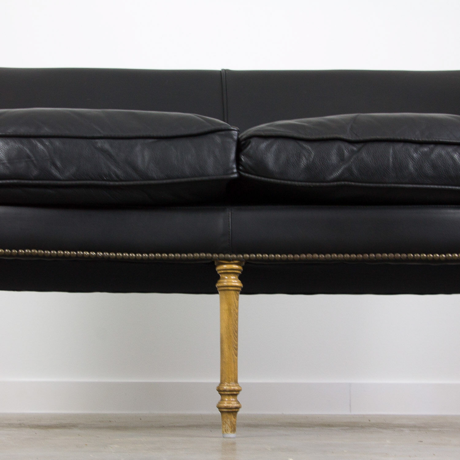 Black leather club sofa