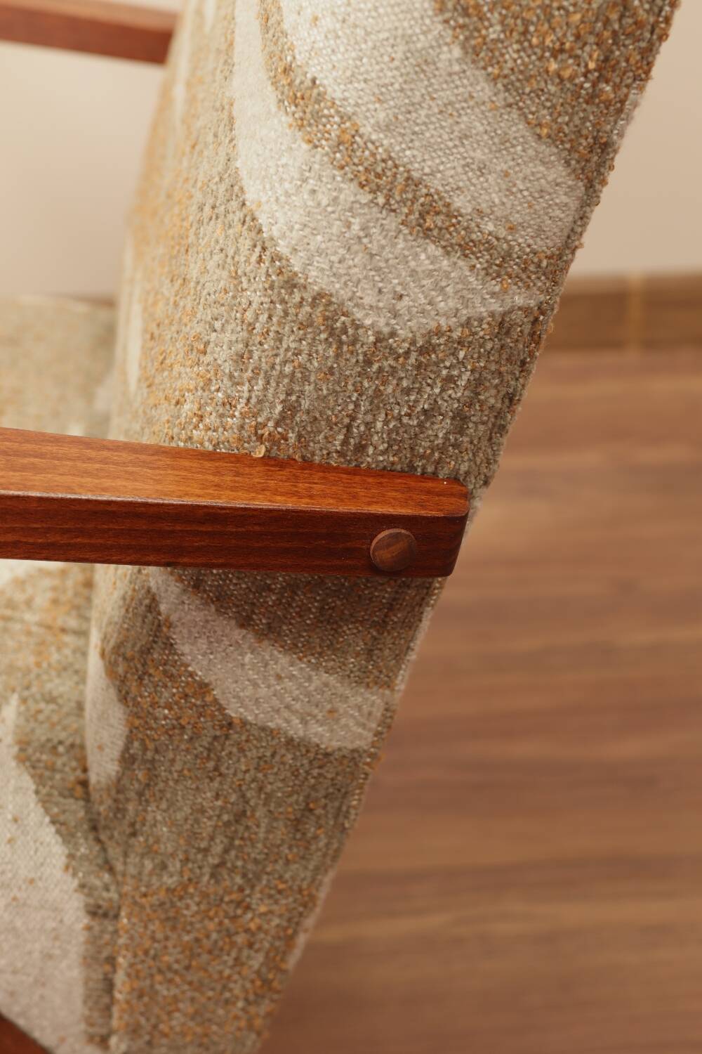 Pair of vintage lounge chairs in brown jacquard fabric and wood.